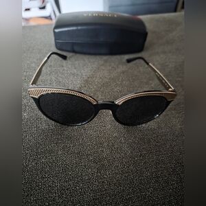 Versace womens sunglasses with case. Black and gold.